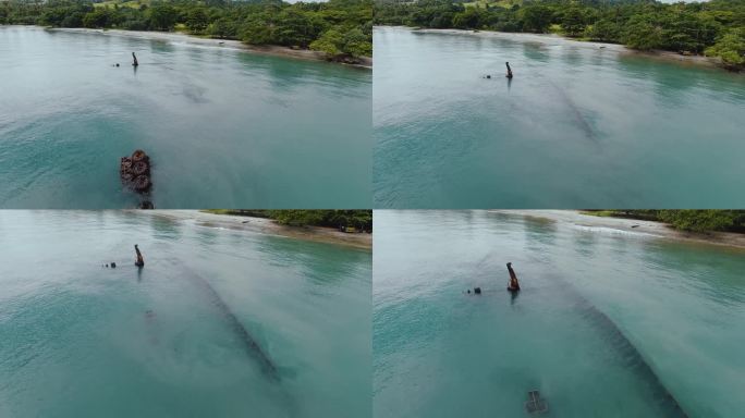 低空飞越的日本二战沉船在浅水。