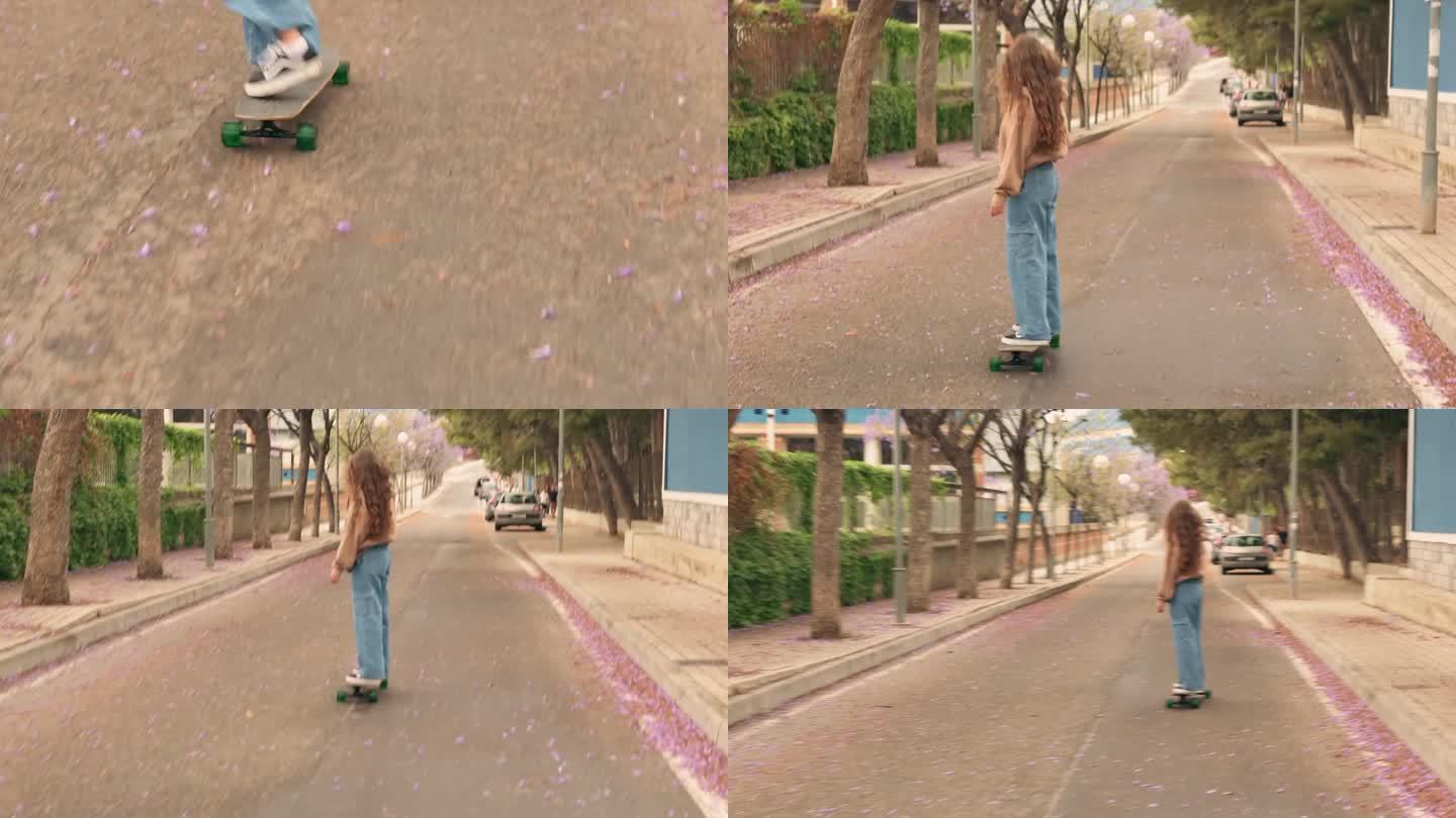 年轻女子沿着街道滑滑板