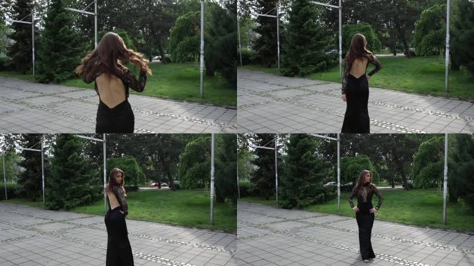 一位穿着黑色长裙、露背的优雅女子正从镜头前走开