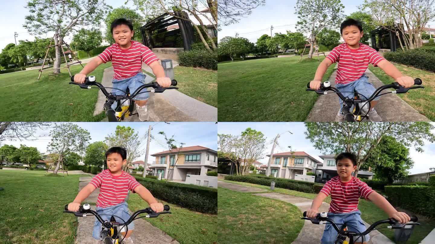 亚洲孩子在小区和跑道上练习骑自行车和踏板车。爱好和休闲的概念