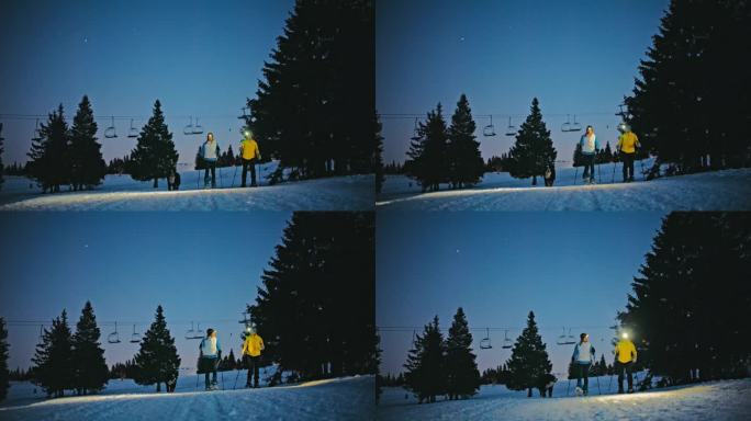 黄昏时分，两名女子在滑雪胜地的雪坡上穿雪鞋