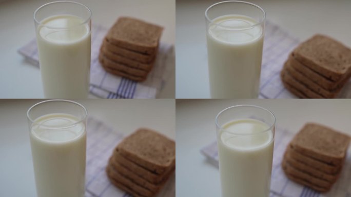 一杯新鲜牛奶配上酸面包作为早餐