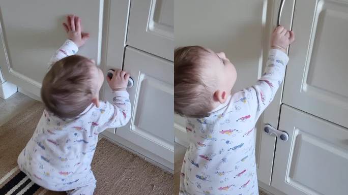 小婴儿打开了一个封闭的壁橱的门。一个好奇的孩子试图打开家具里的抽屉。8个月大的孩子