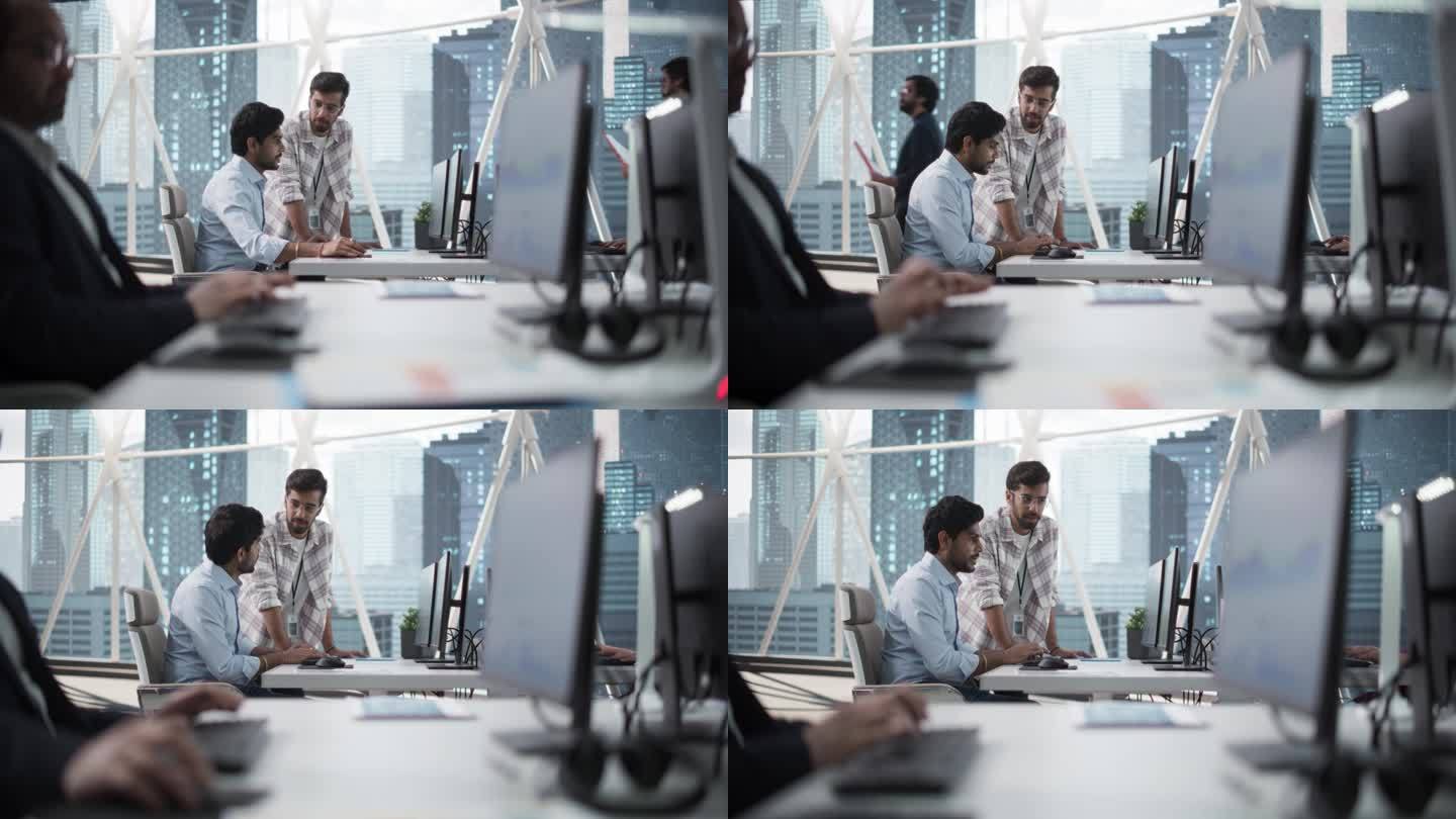 两个印度同事在忙于一个商业项目时交谈。软件工程师在会议中与项目经理交谈。现代公司办公室的团队合作
