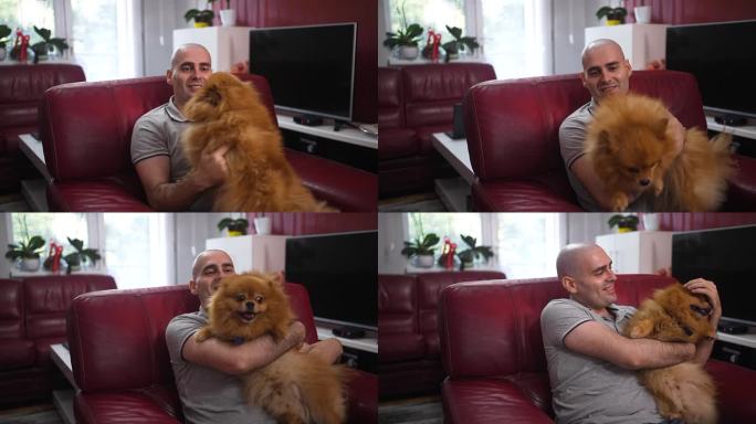 癌症病人在家里坐在椅子上和他的狗玩耍