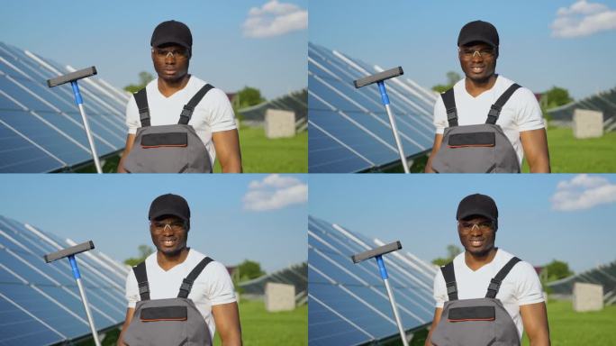 非裔美国工人在太阳能电池板旁用刷子的肖像