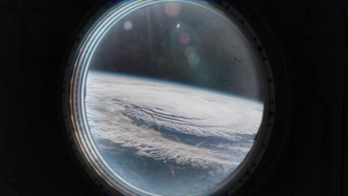 宇宙飞船的舷窗向外展示了一幅外星风景