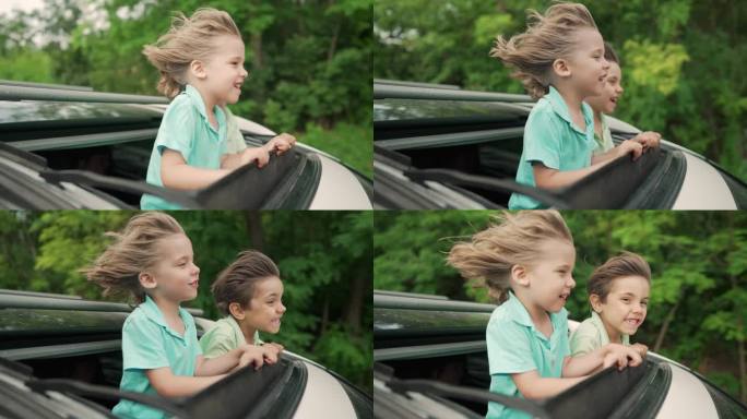 可爱快乐的小男孩，孩子们在开放的汽车天窗在公路旅行，夏天