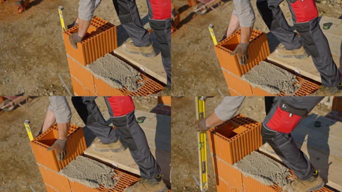 SLO MO砌砖工对工地空心砖气泡水平的精确检查
