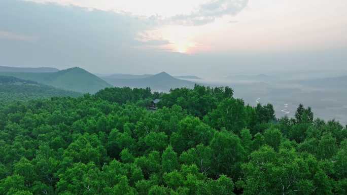 航拍夏季大兴安岭林海山谷云雾日出