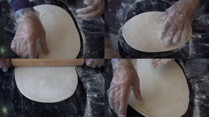 意大利厨师准备披萨面团，在石桌上擀面，开始制作披萨