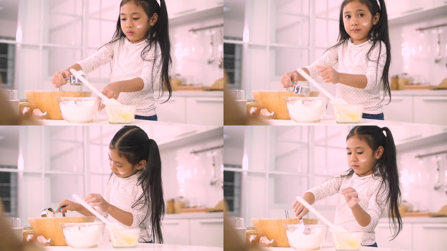 小女孩在家厨房里烤面包