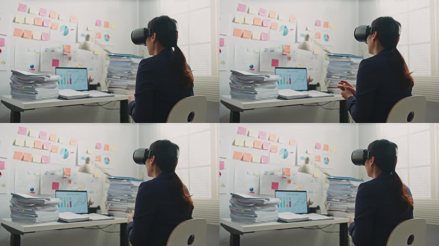 女商人带着VR眼镜在办公室开视频会议