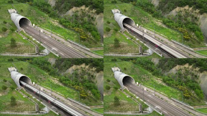 一列高速客运列车离开山脚下隧道的无人机全景图。俯瞰法国南部的群山