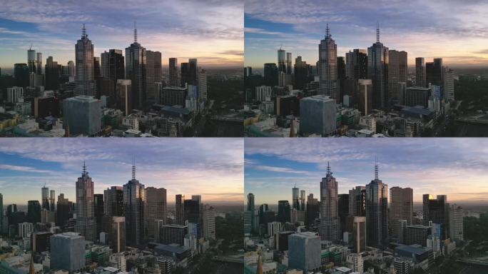 4K鸟瞰墨尔本市中心商业区的实时镜头，通过各种现代办公大楼和交通街道在墨尔本的早晨