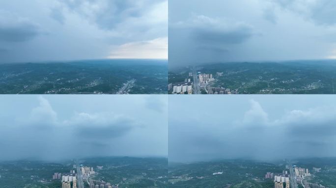 航拍夏天突然乌云阵阵前方下雨场面