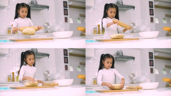 小女孩在家厨房里烤面包