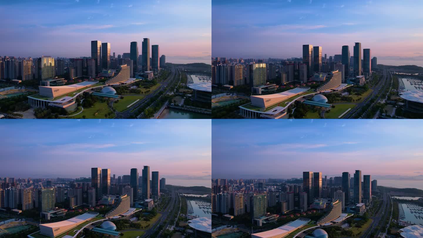航拍厦门国际会展中心，清晨早霞映红天边