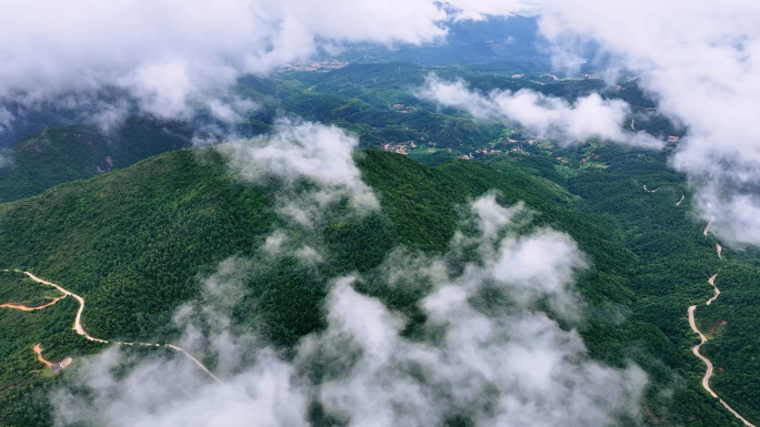 云层下的山林村庄山间小道4K航拍