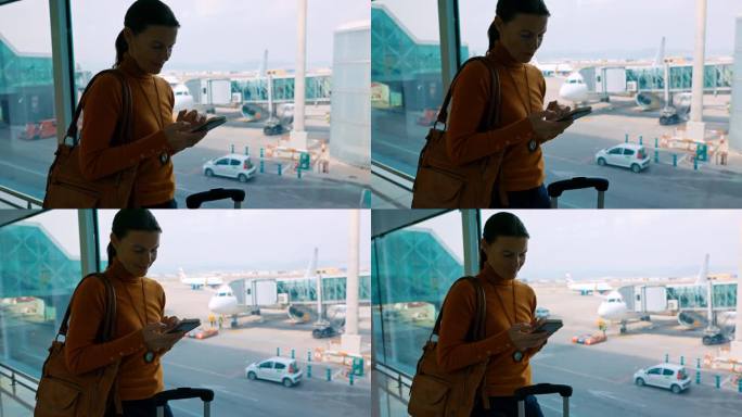MS Woman在机场候机时使用智能手机