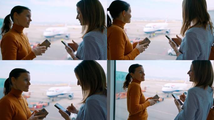 两位女士在机场登机口使用智能手机