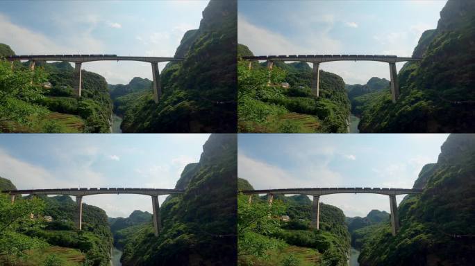 火车鸣笛从汕昆铁路山中峡谷上的大桥上经过