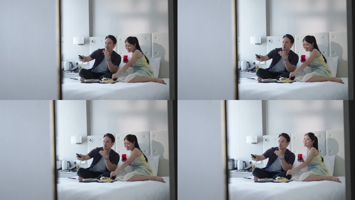 亚洲夫妇在度假旅行时在酒店房间里亲密无间
