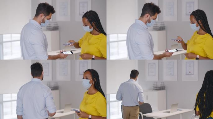 非裔美国女性经理用智能手机扫描员工的疫苗qr码