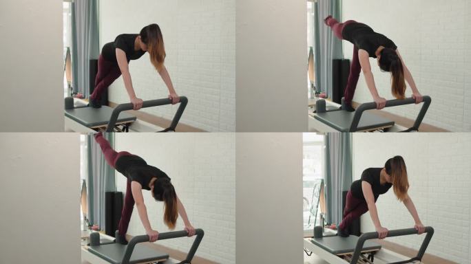 在普拉提健身机上锻炼的女性，健康的健身生活方式。