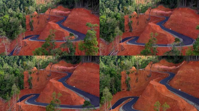 AH -印度尼西亚亚齐省热带森林之间的公路鸟瞰图