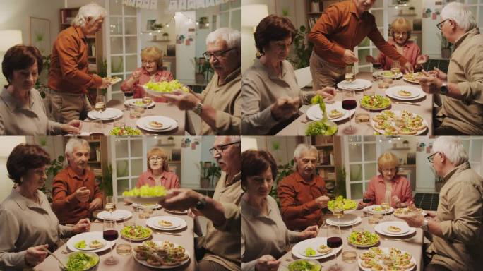 老年夫妇在家庭聚会上用节日菜肴招待朋友
