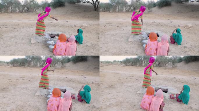 拉贾斯坦邦，年轻的印度女孩从井里取水
