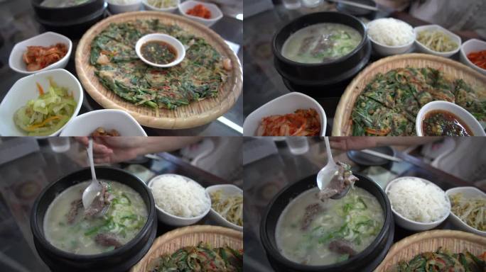 手吃韩牛牛骨汤全韩式传统料理煎饼和配菜动作拍摄4k