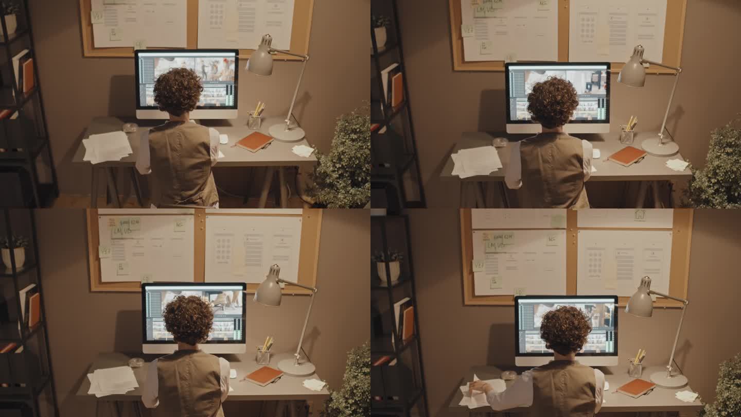 坐在电脑前编辑视频的女人