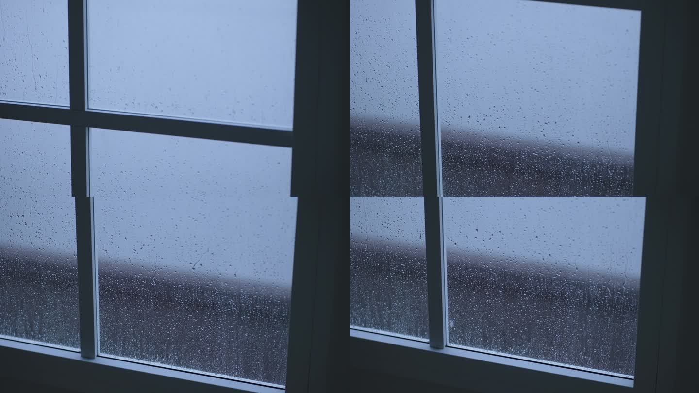 雨季，雨滴在现代房屋窗户上的缓慢运动