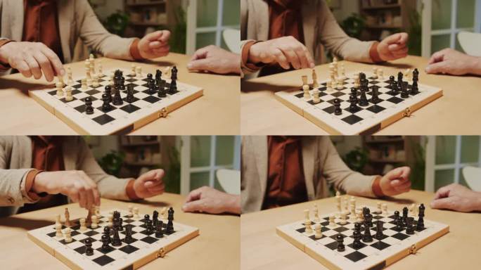 下棋时，男性手移动棋盘上的黑白图形