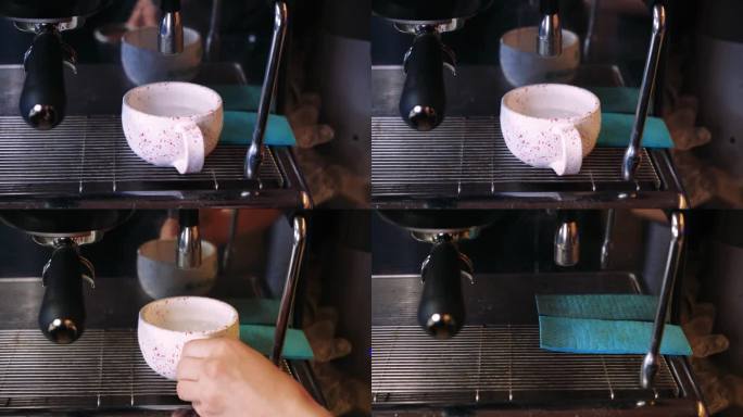 视频咖啡从机器流到杯子里。自制的热浓咖啡。现磨咖啡流。咖啡师在咖啡馆准备咖啡。