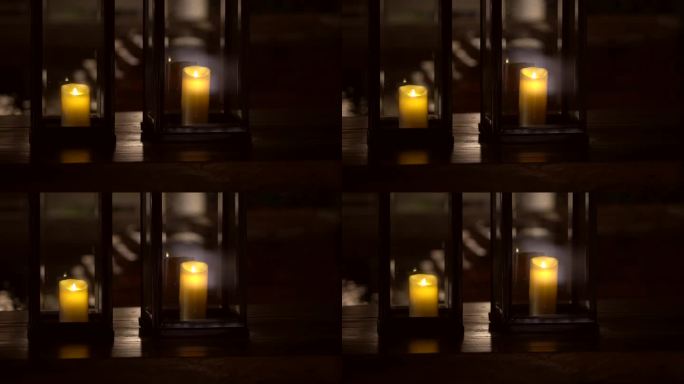 金属蜡烛和玻璃灯放置在房屋木甲板上，古典花园照明热带当代设计4k