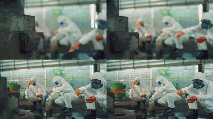 科学家在受感染的工厂区域采集有害生物样本。一组科学家在防护工作服的探索和取样分析。