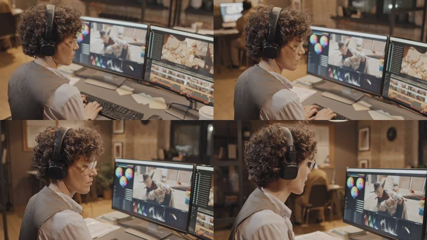 女人在两个电脑屏幕前打字
