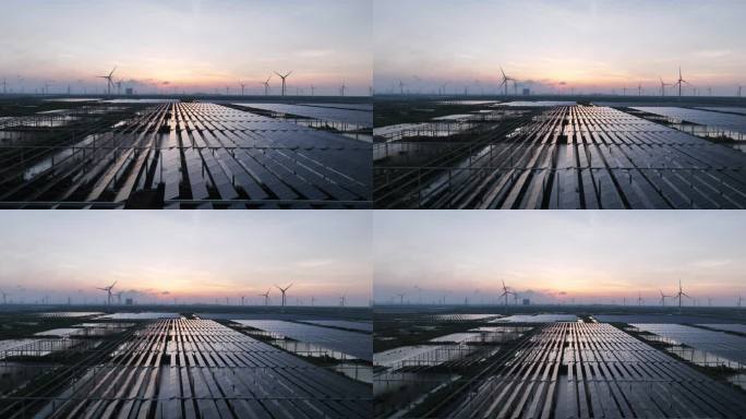 夕阳下风力发电场和太阳能光伏发电站航拍