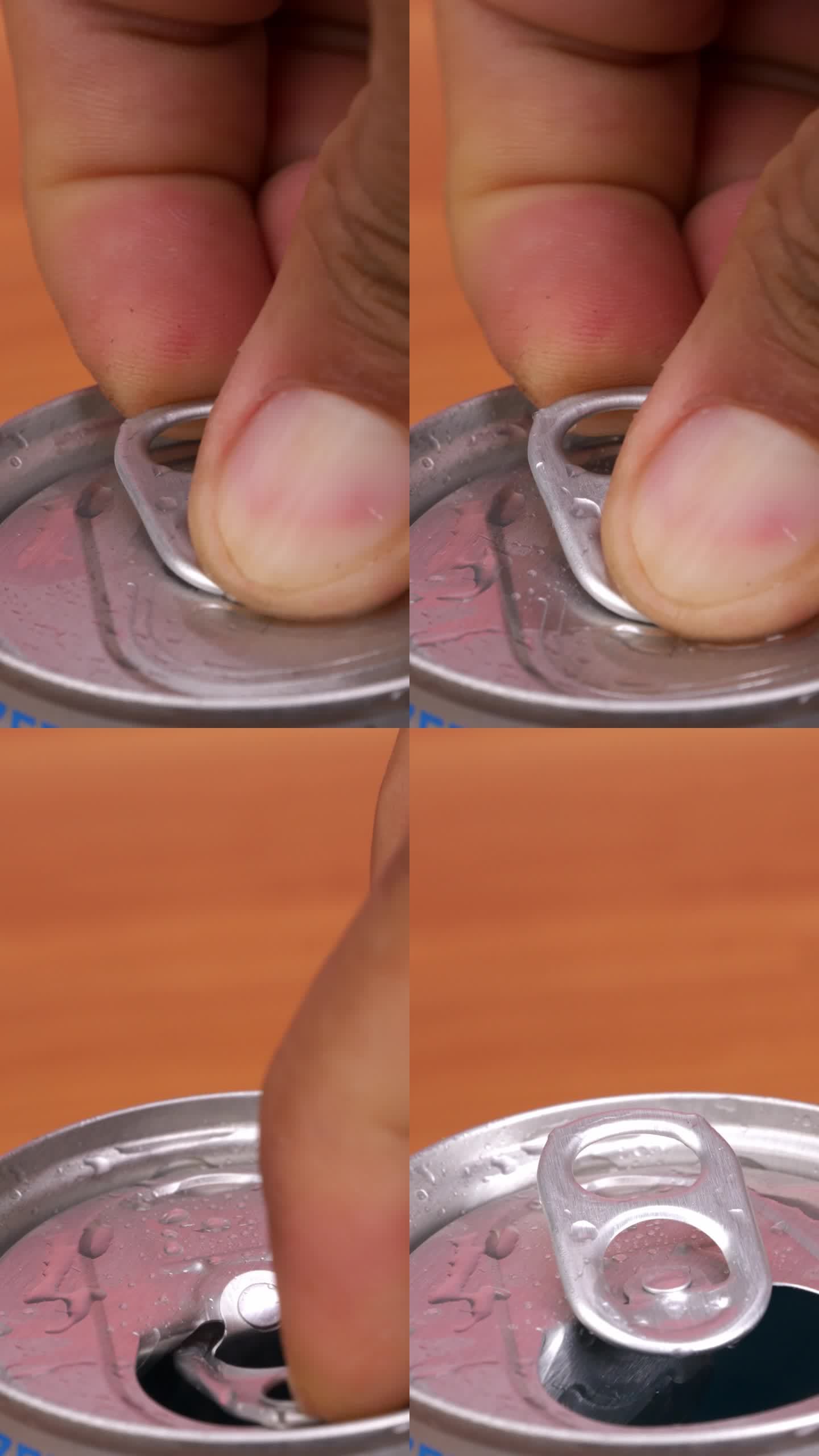 用手打开汽水罐的盖子。