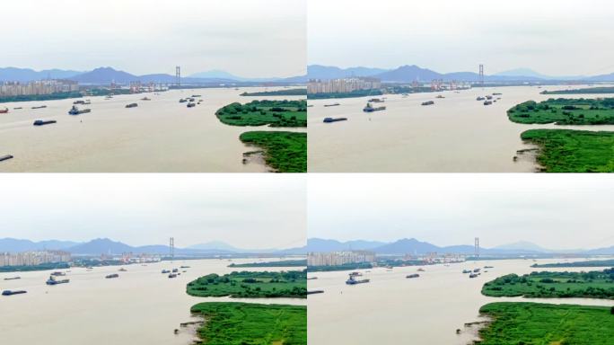 航拍轮船货轮航行长江江边堤岸润扬大桥