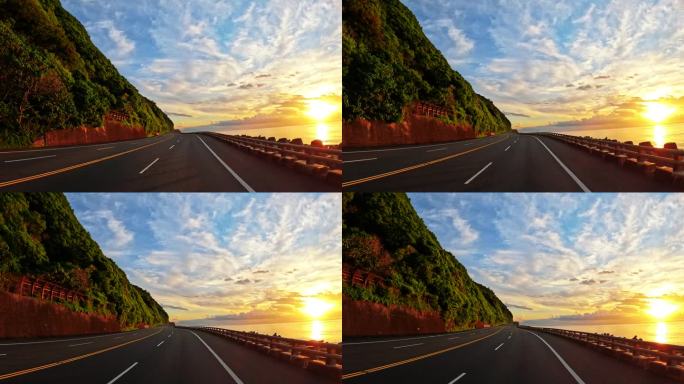 在台湾南部沿海高速公路上，开车进入日出。