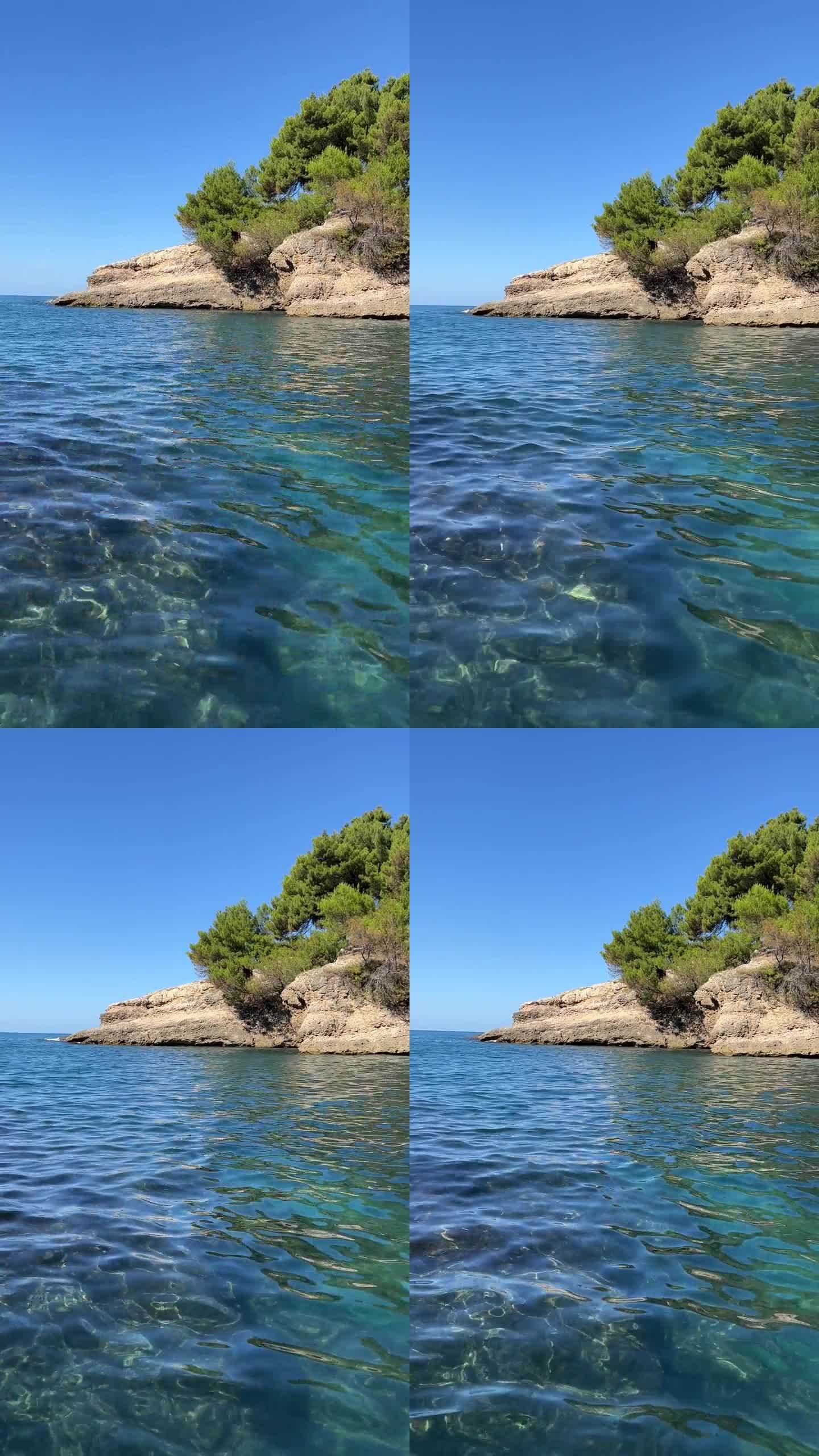 蓝色的大海和岩石在松木海岸在夏天，垂直视频。