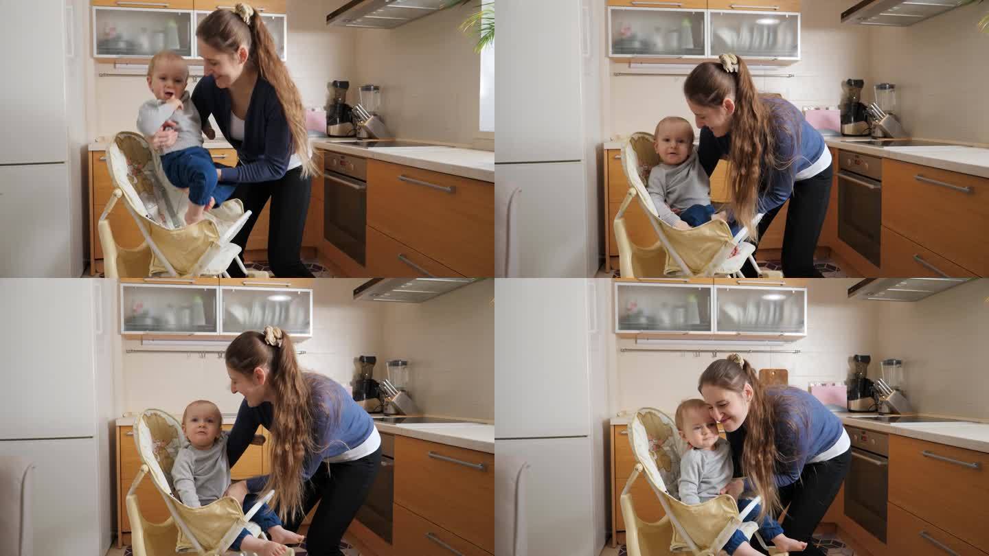 年轻有爱心的母亲在给孩子准备早餐前，让她的孩子坐在厨房的高脚椅上。育儿理念，健康营养和婴儿护理