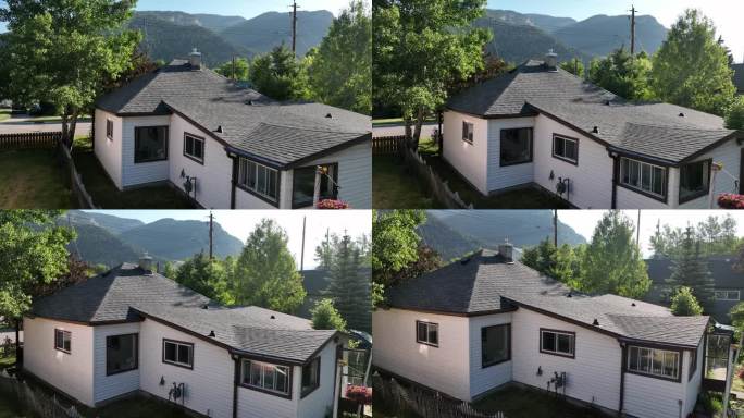 鸟瞰图，在绿树成荫的社区里，一座朴素的老房子