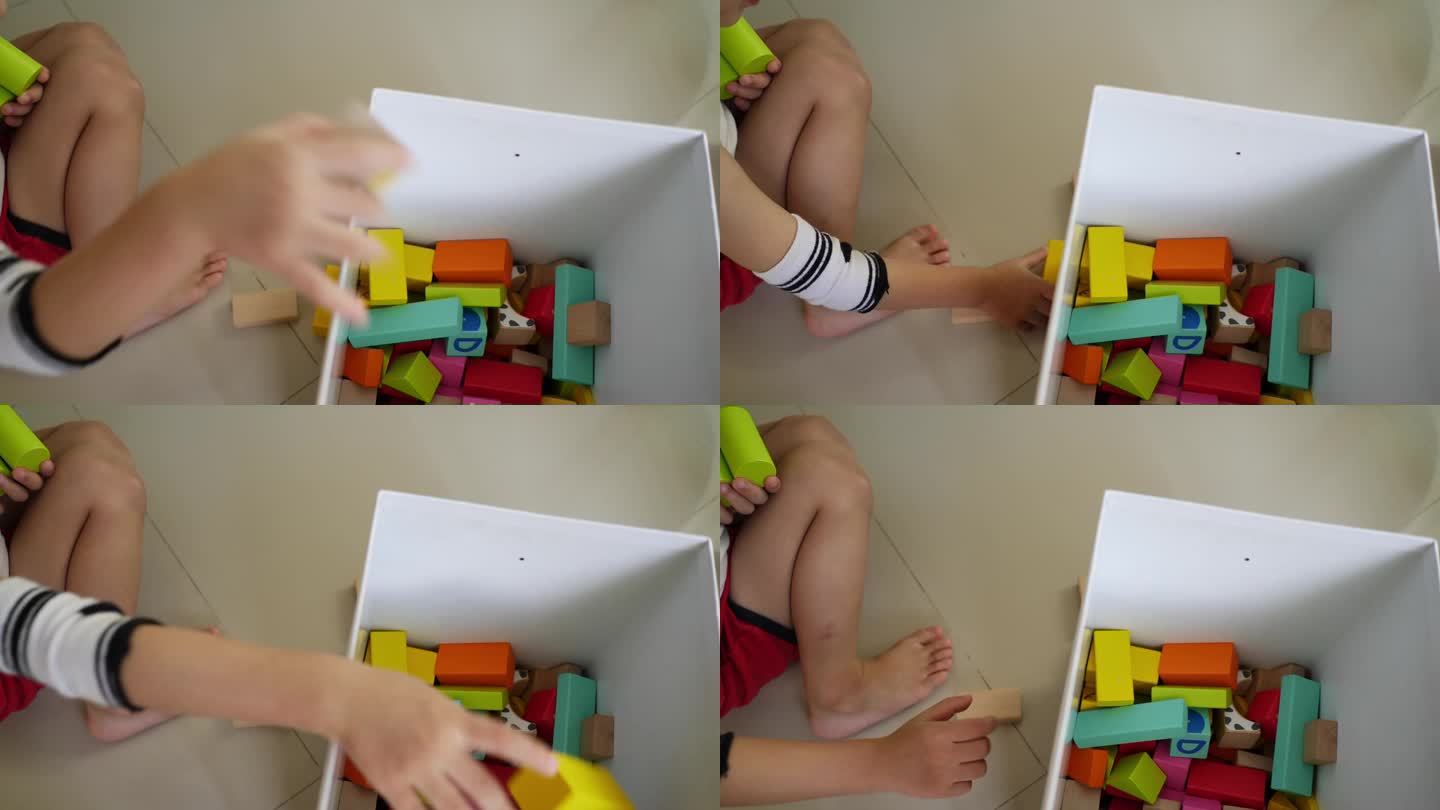 小男孩用许多五颜六色的木块搭起一座城市，进行创意玩具的设计