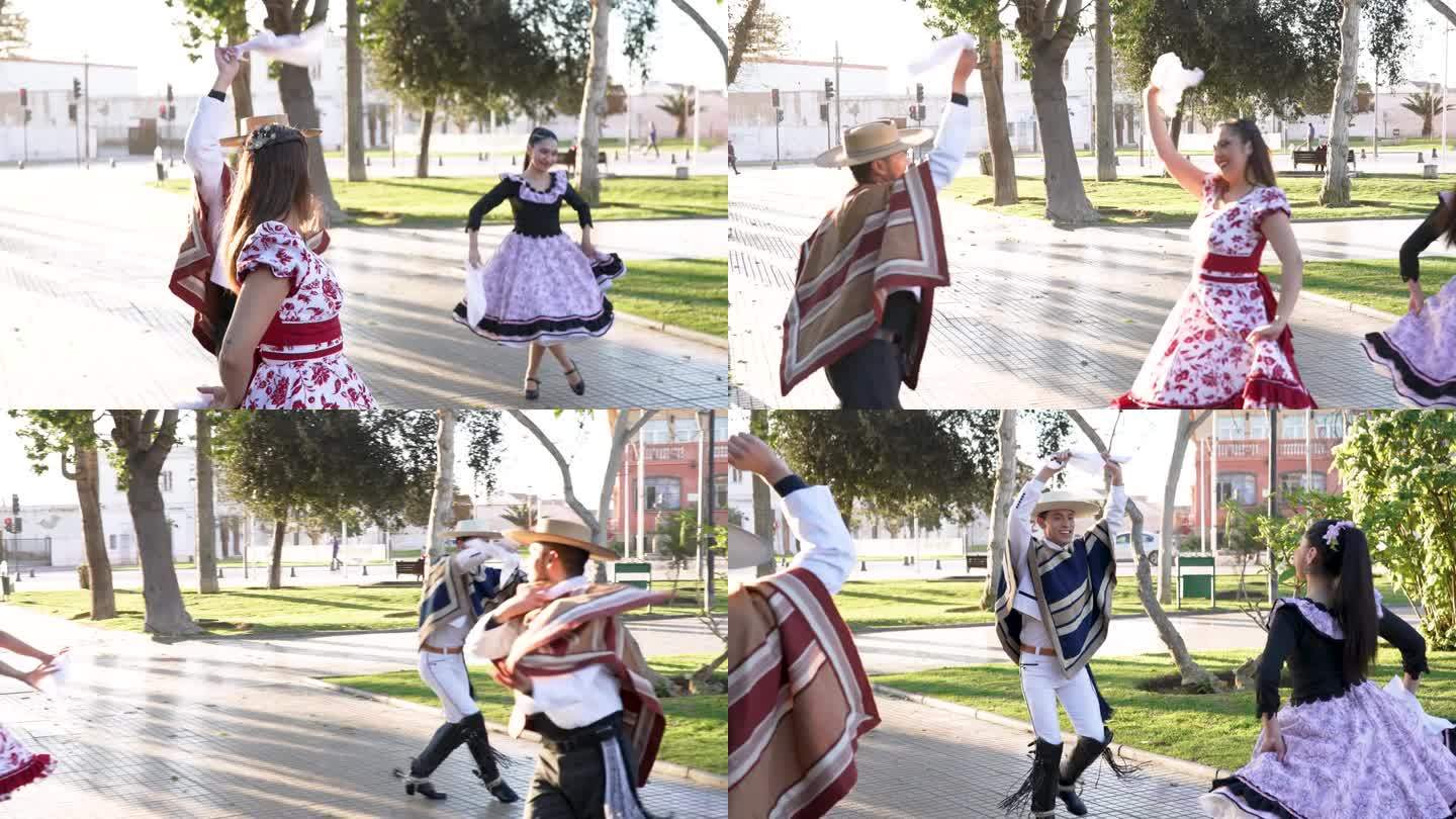 拉丁美洲年轻的情侣们穿着花衣跳着民间传说中的cueca舞