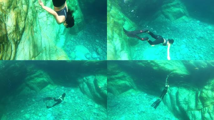 穿着长脚蹼的女生在水下快乐的自由潜水